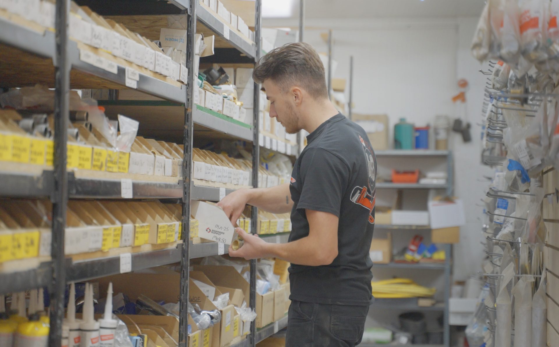worker picking plumbing parts in warehouse new